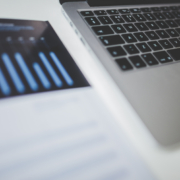 printed graph next to a computer