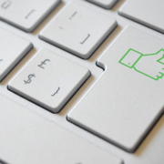 keyboard with enter button replaced by a green thumbs up symbol