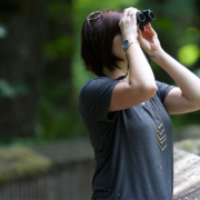 Woman looking through binocculars