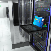 A laptop inside a server room.