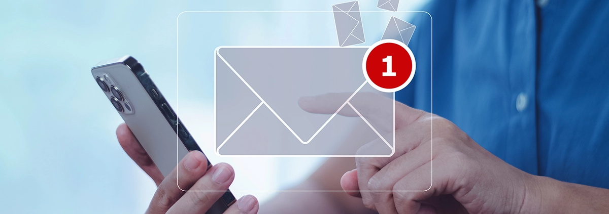 An illustration showing a man holding his phone with a new email notification.
