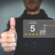 A man giving a thumbs up, illustrating a five-star review.