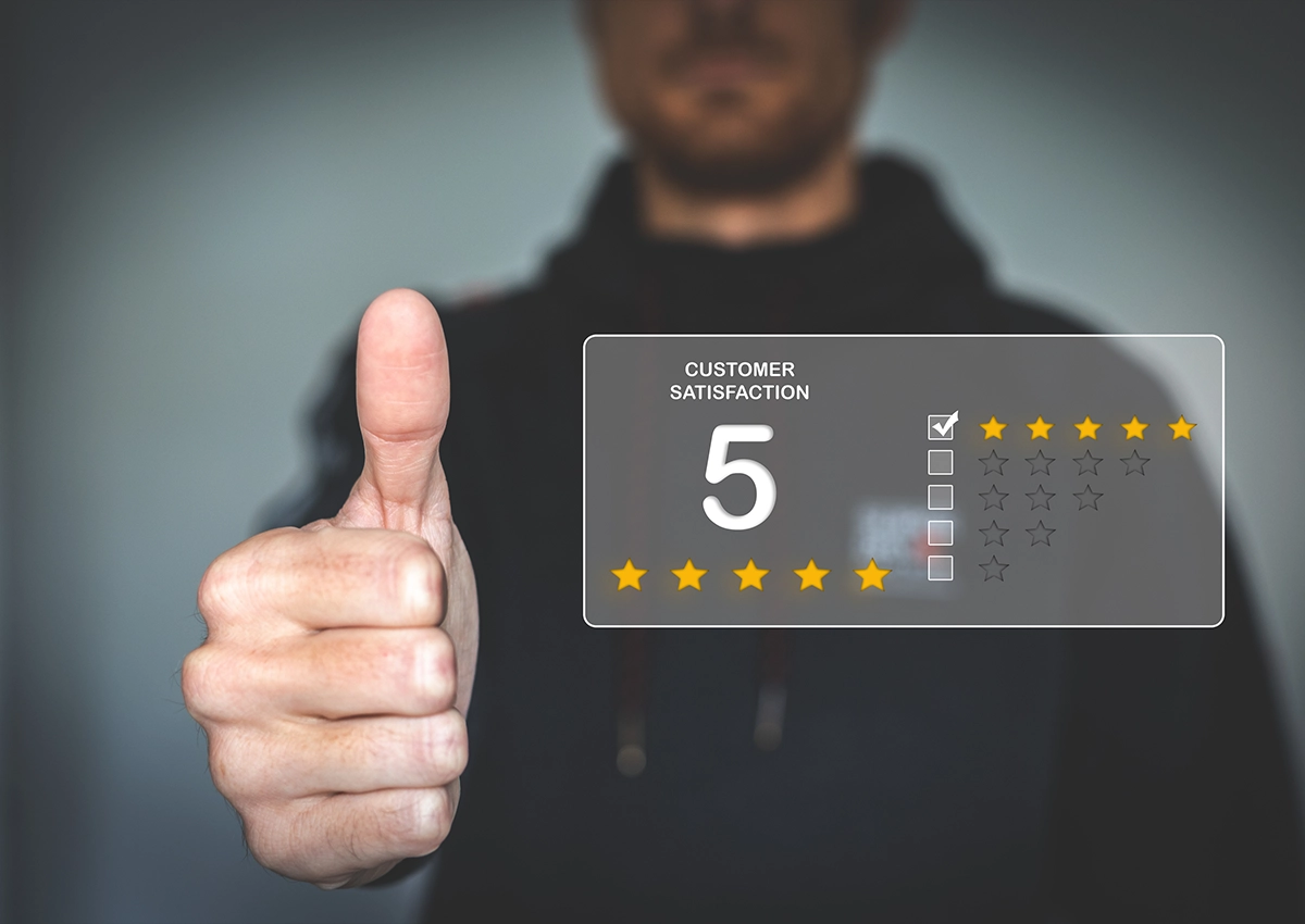 A man giving a thumbs up, illustrating a five-star review.